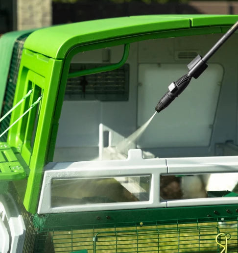 Pressure washing or hosing a plastic chicken coop is quick and easy
